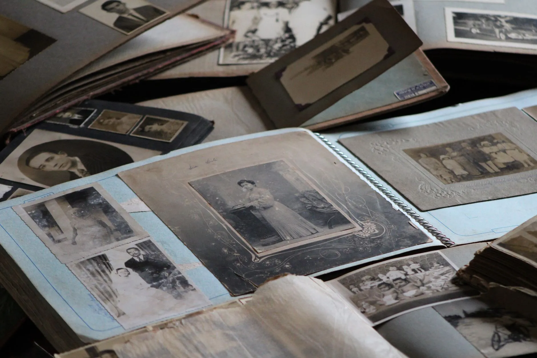 An open family photo album with ageing prints